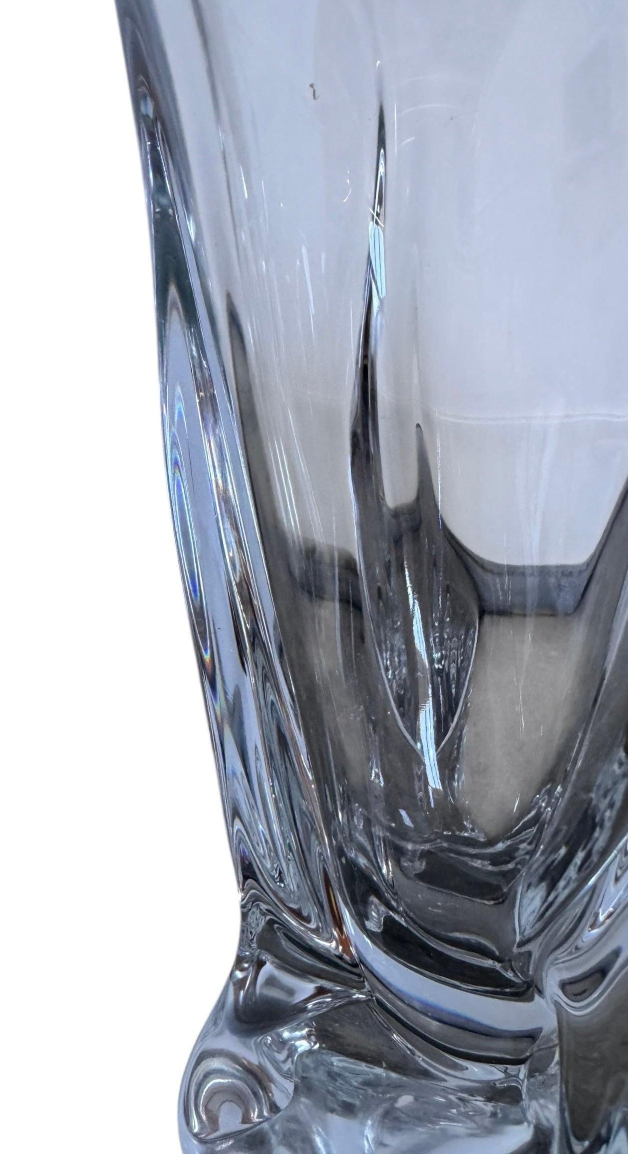 A clear crystal vase with a flared opening and a twisted, sculptural base.
The provided image is of a vintage Vannes Le Châtel crystal vase, which is a piece of French art glass