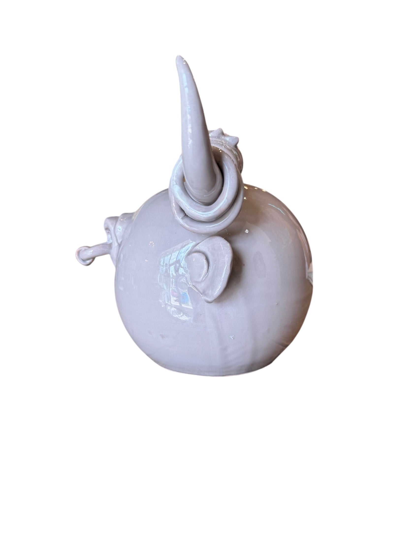 Artistic white grey ceramic bull sculpture by Enza Fasano, featuring a minimalist design and rings on the horns