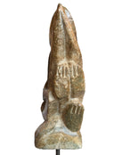 Figural sculpture in the Shona style, Zimbabwe. Two abstracted figures are intertwined, carved from greenish-brown soapstone. Sculpture rests on a dark iron stand.