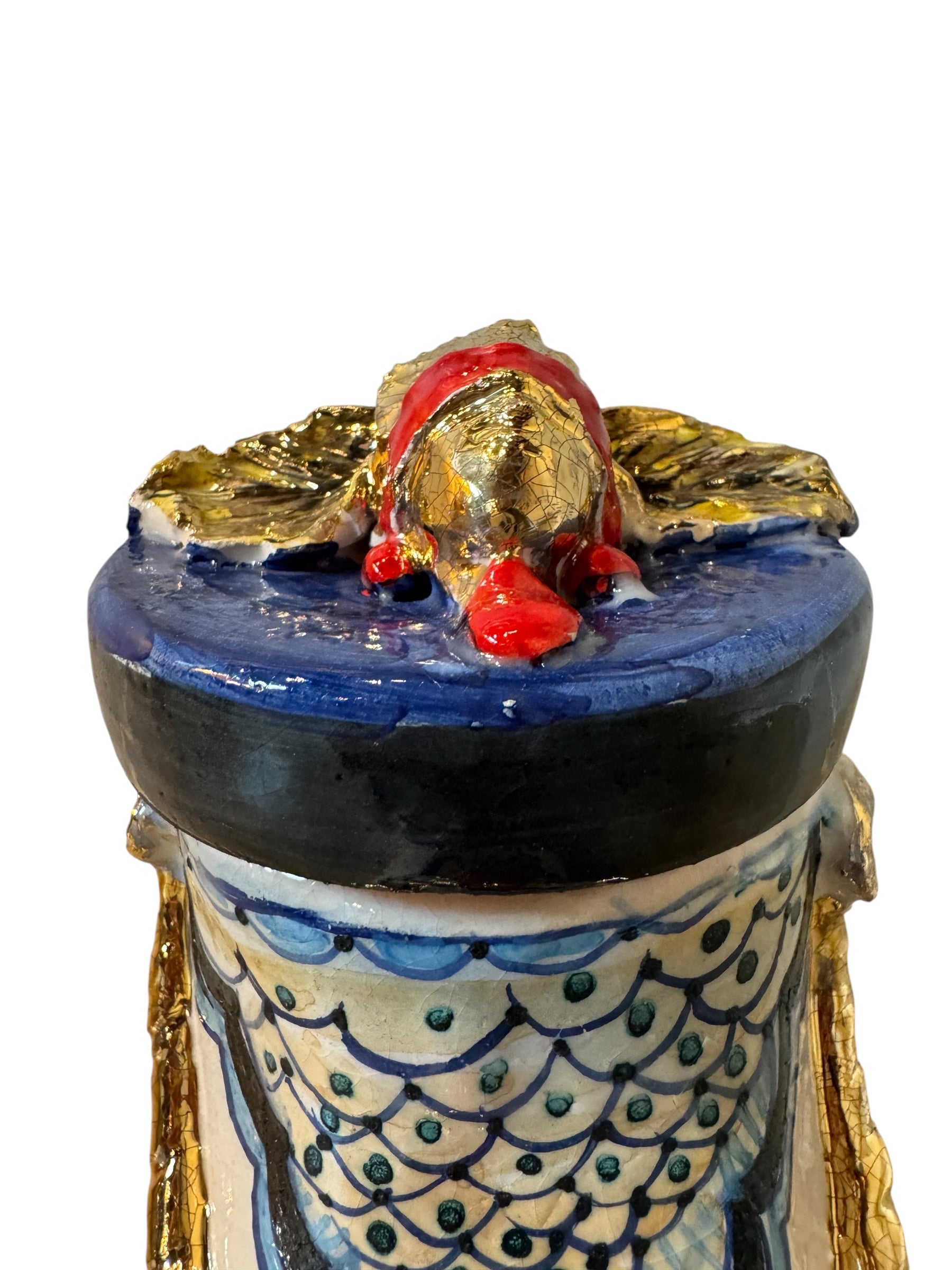 Ceramic foot sculpture by Domenico Pinto featuring hand-painted details, gold accents, a sacred heart, and an angel figure with a blindfold
