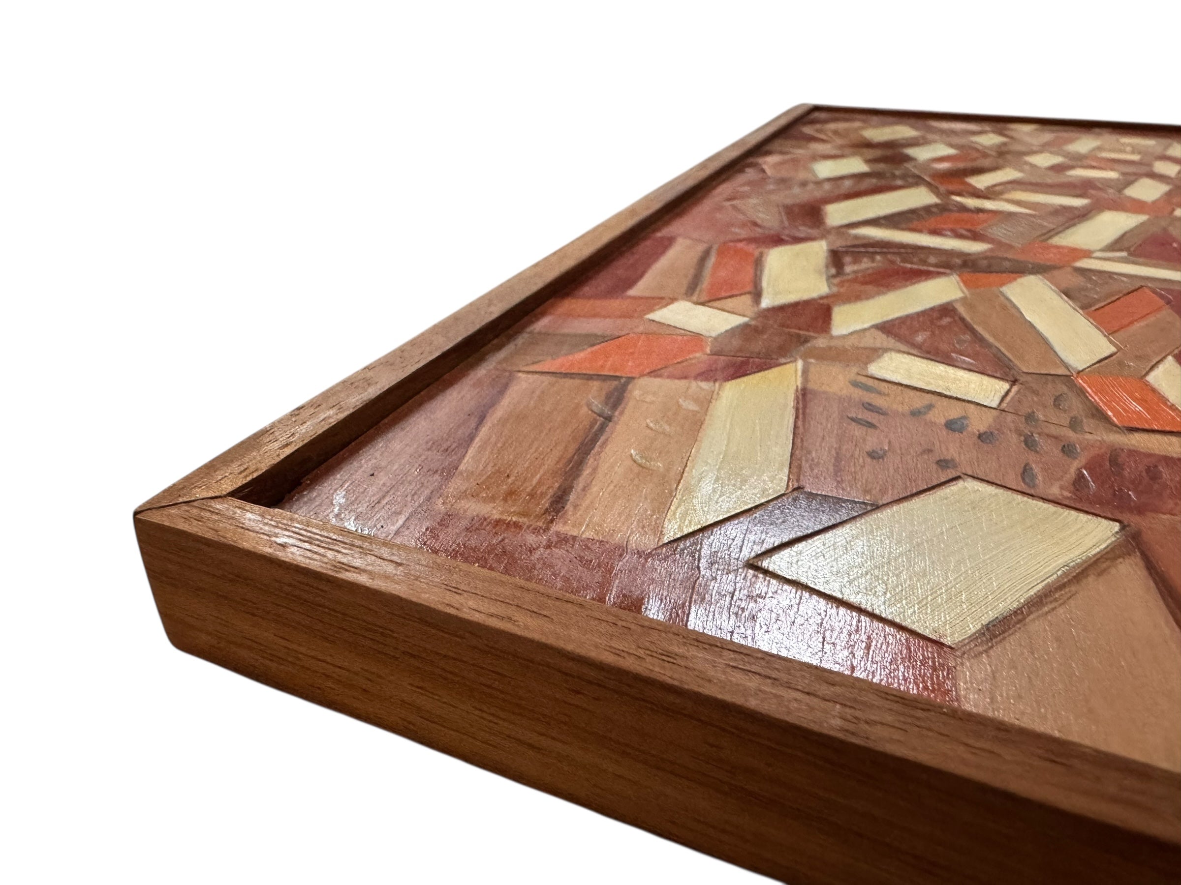 Geometric abstract painting, 'Radiating Blocks' by Robert Wymer, using warm tones of red, orange and white on mahogany plywood. The composition features layered, angular blocks and incised lines, presented in a carved mahogany frame.