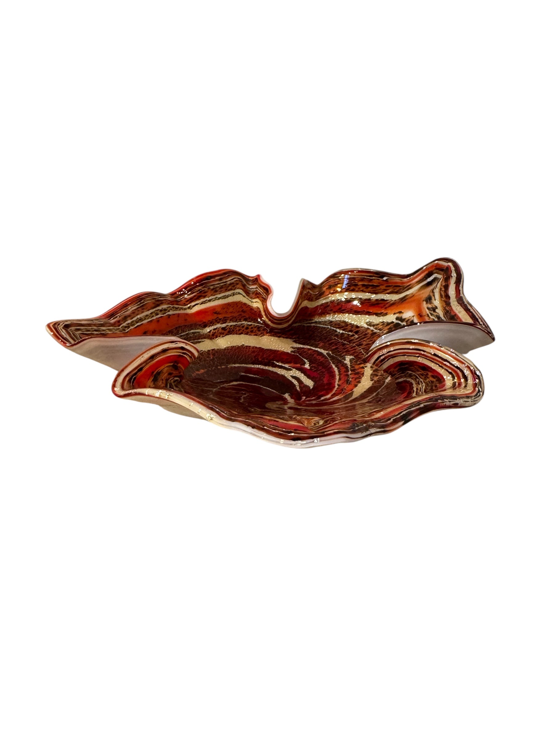 A Murano art glass bowl with a freeform shape, featuring layered swirls of brown, orange, and cream, accented with gold flecks. The bowl has a translucent white base.