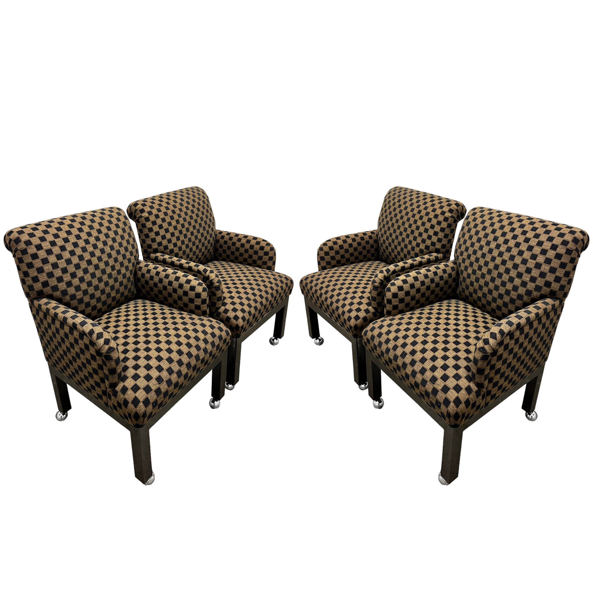 A set of four vintage checkered roll back chairs with chrome casters.