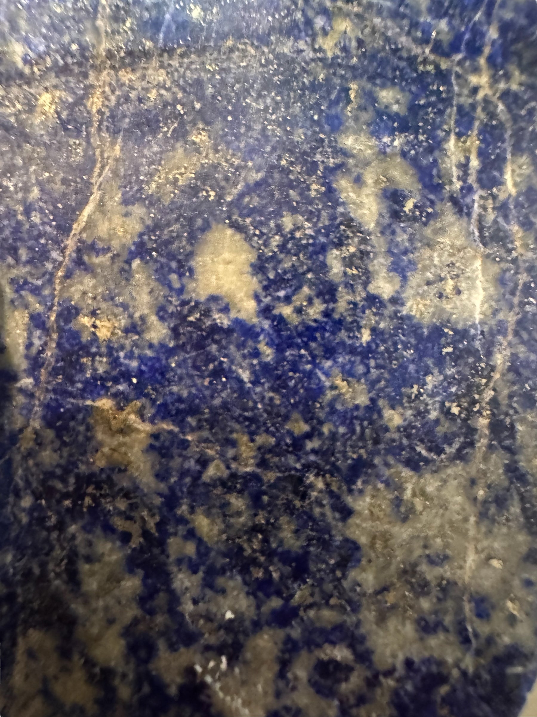 Hand-carved octagonal box made of lapis lazuli, featuring a red cabochon stone on its lid.