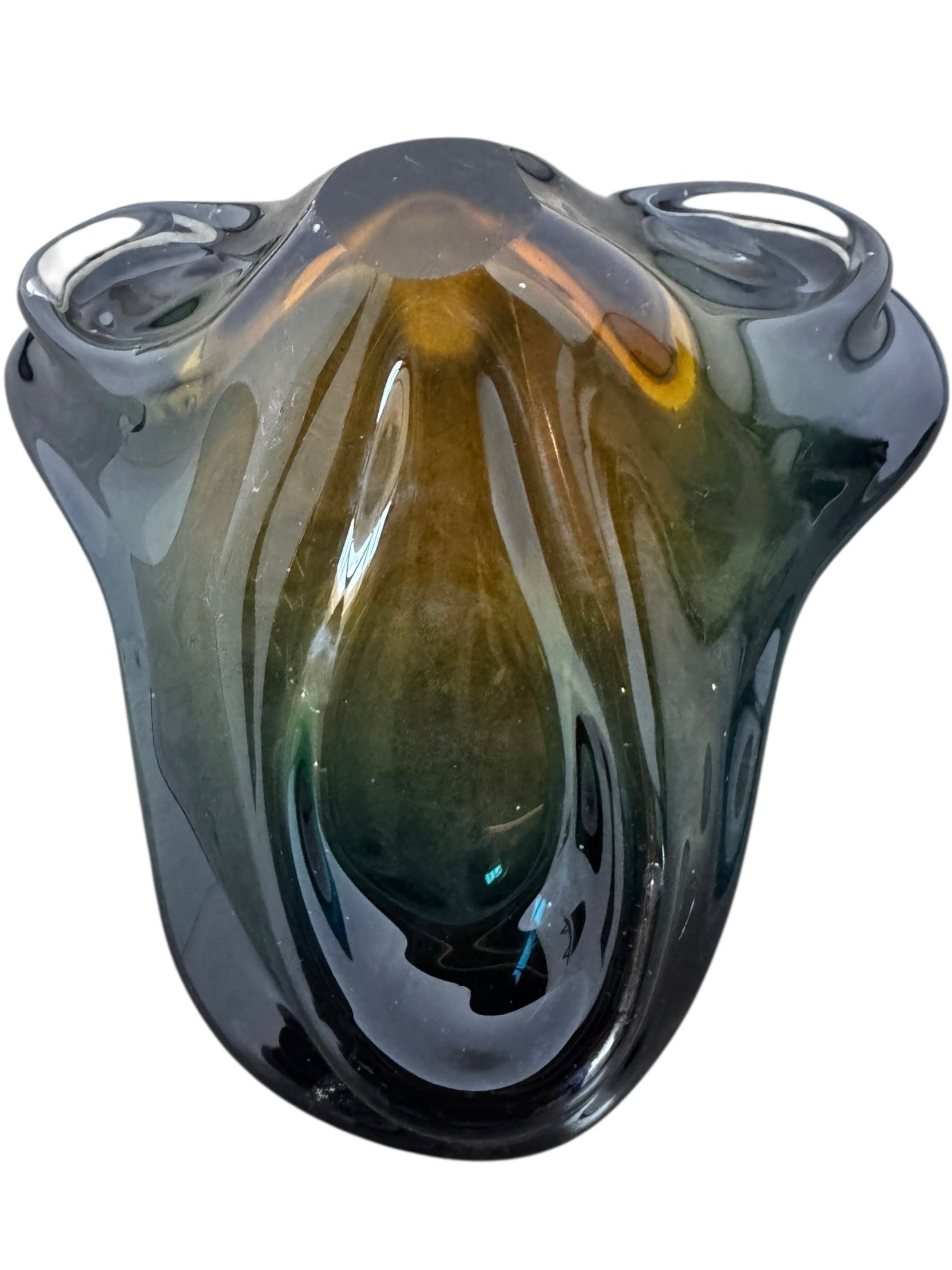 A vintage, hand-blown art glass bowl with a wavy, organic shape and a blue and amber/yellow swirl design