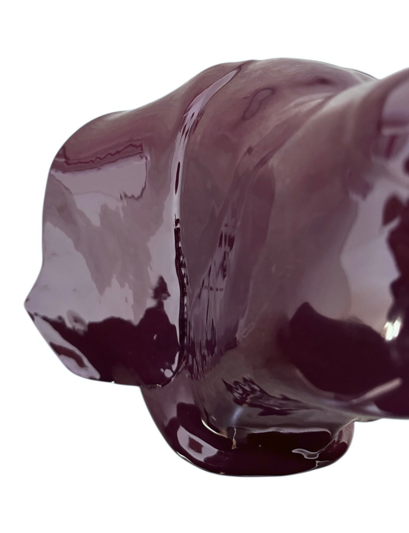 A glossy, dark chocolate brown ceramic bust of a Labrador dog. Created by Enza Fasano, the sculpture features a minimalist, stylized design with smooth, flowing lines and a high-shine glaze that reflects light. The dog’s long ears drape down the sides, and its snout is rounded, capturing the gentle essence of the breed in a contemporary Italian pottery style.