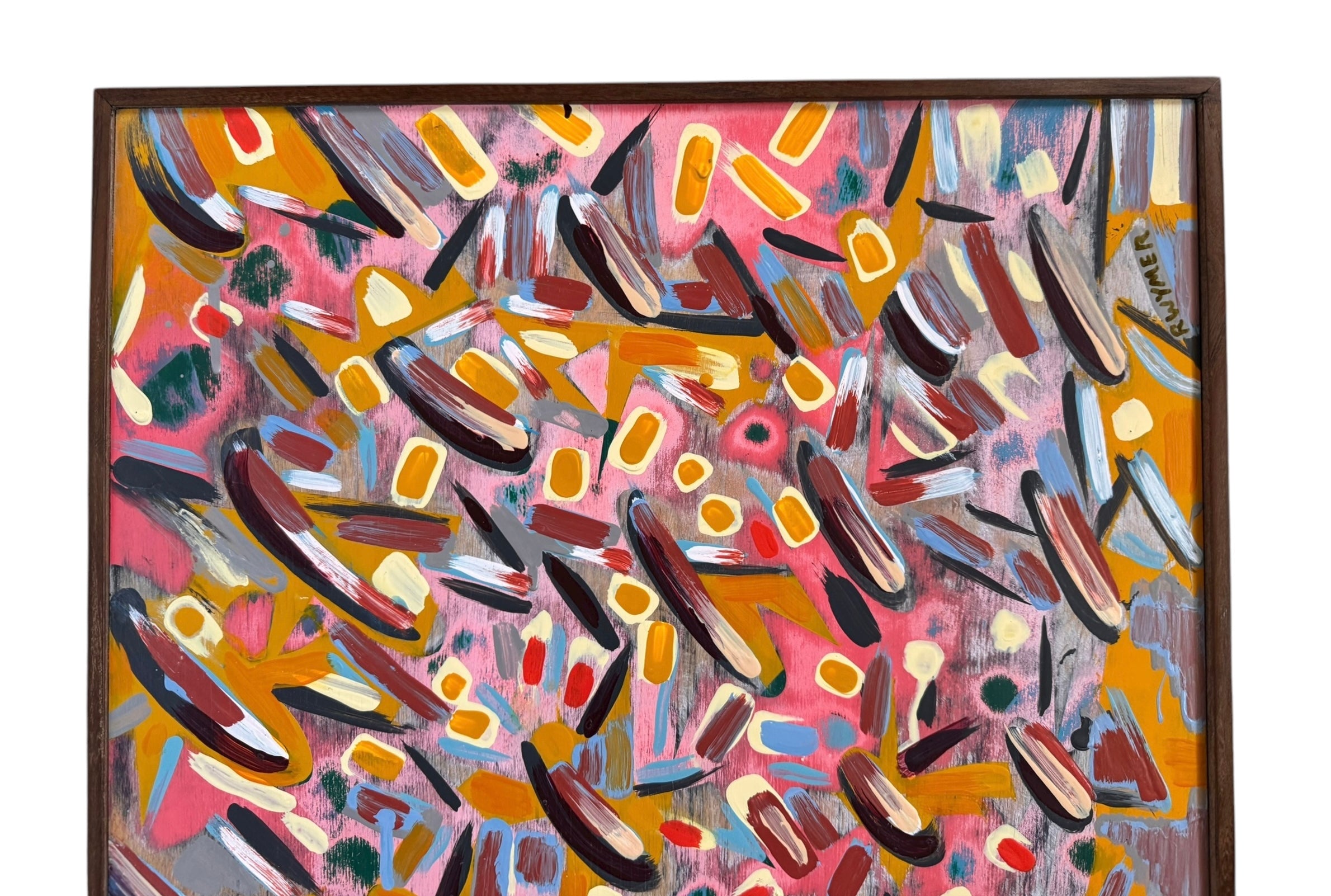 An abstract painting titled 'Cascade of Gold and Pink' by Robert Wymer, framed in dark wood. The artwork features a vibrant pink background densely covered with a dynamic arrangement of multi-directional, oblong, and dash-like brushstrokes in gold, red, blue, gray, white, and black.