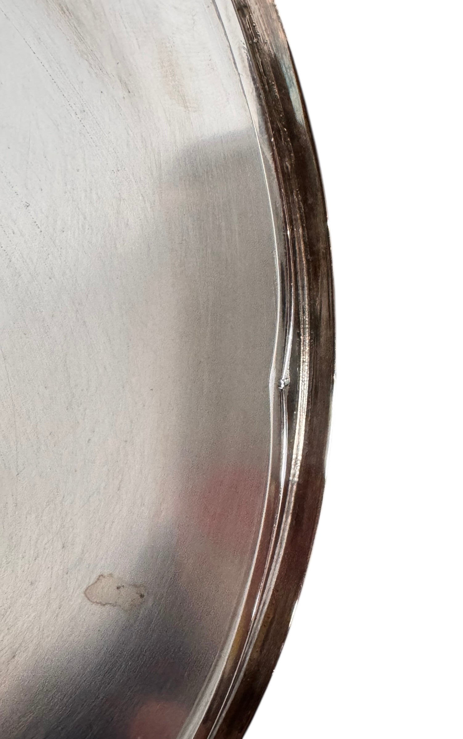 Round St. James silver-plated lidded serving dish from the 1980s, featuring a minimalist modernist design with geometric side handles and a sculptural, biomorphic finial, showing visible vintage wear and pitting on the metallic surface.