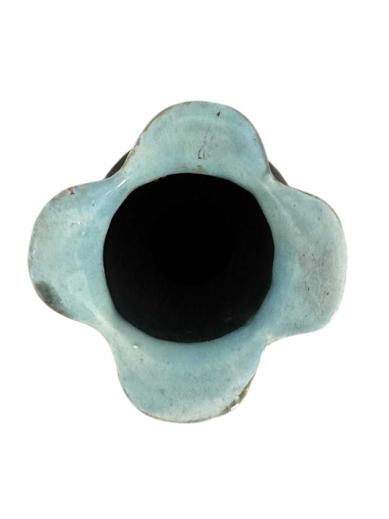 An ornate, dark glazed ceramic Art Nouveau vase with two handles and raised floral designs in yellow, purple, and green.