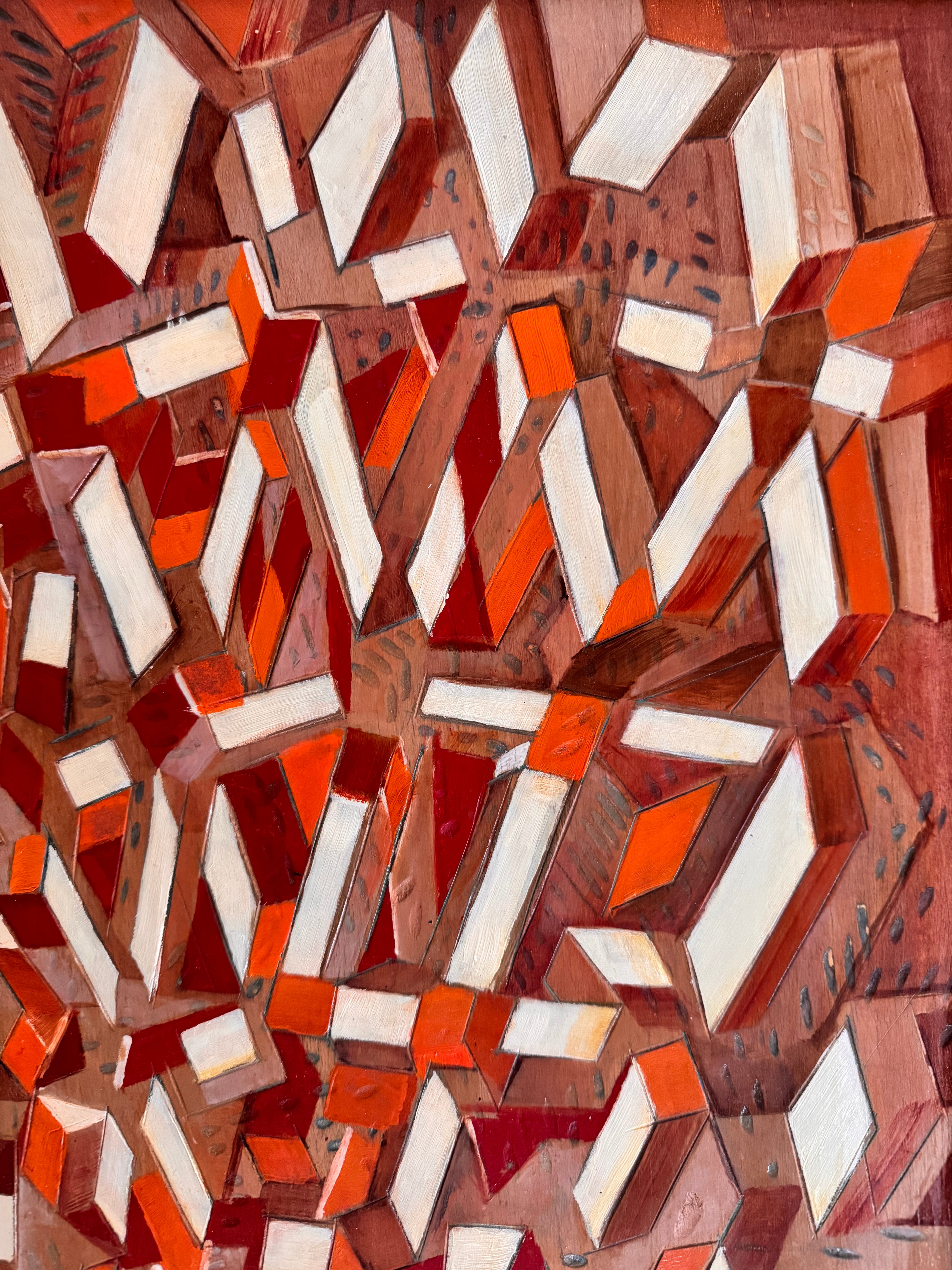 Abstract pattern of geometric shapes in brown, orange, and white.