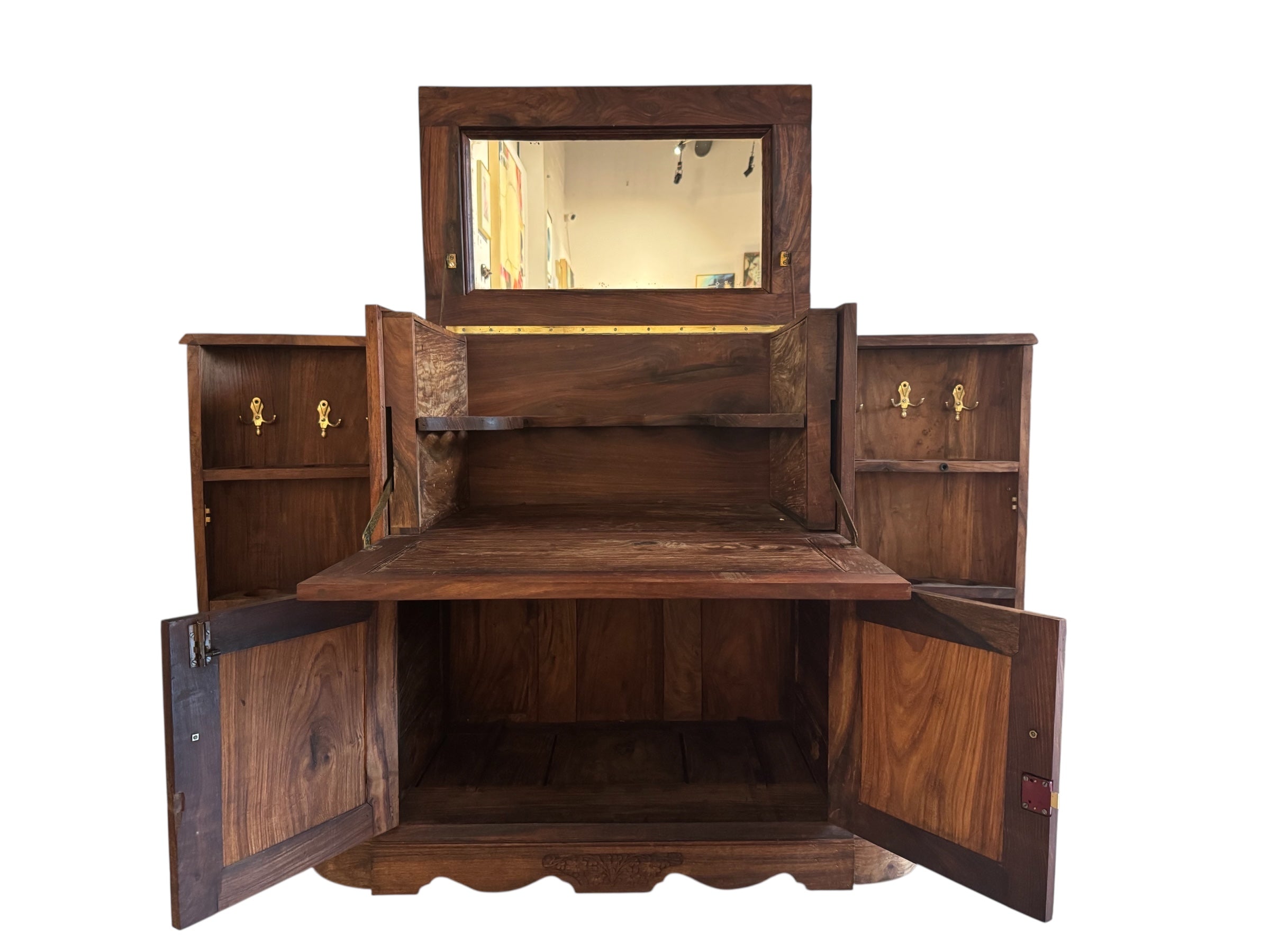 Antique bar cabinet with wood inlay and brass floral details, open to reveal interior shelving and bar storage