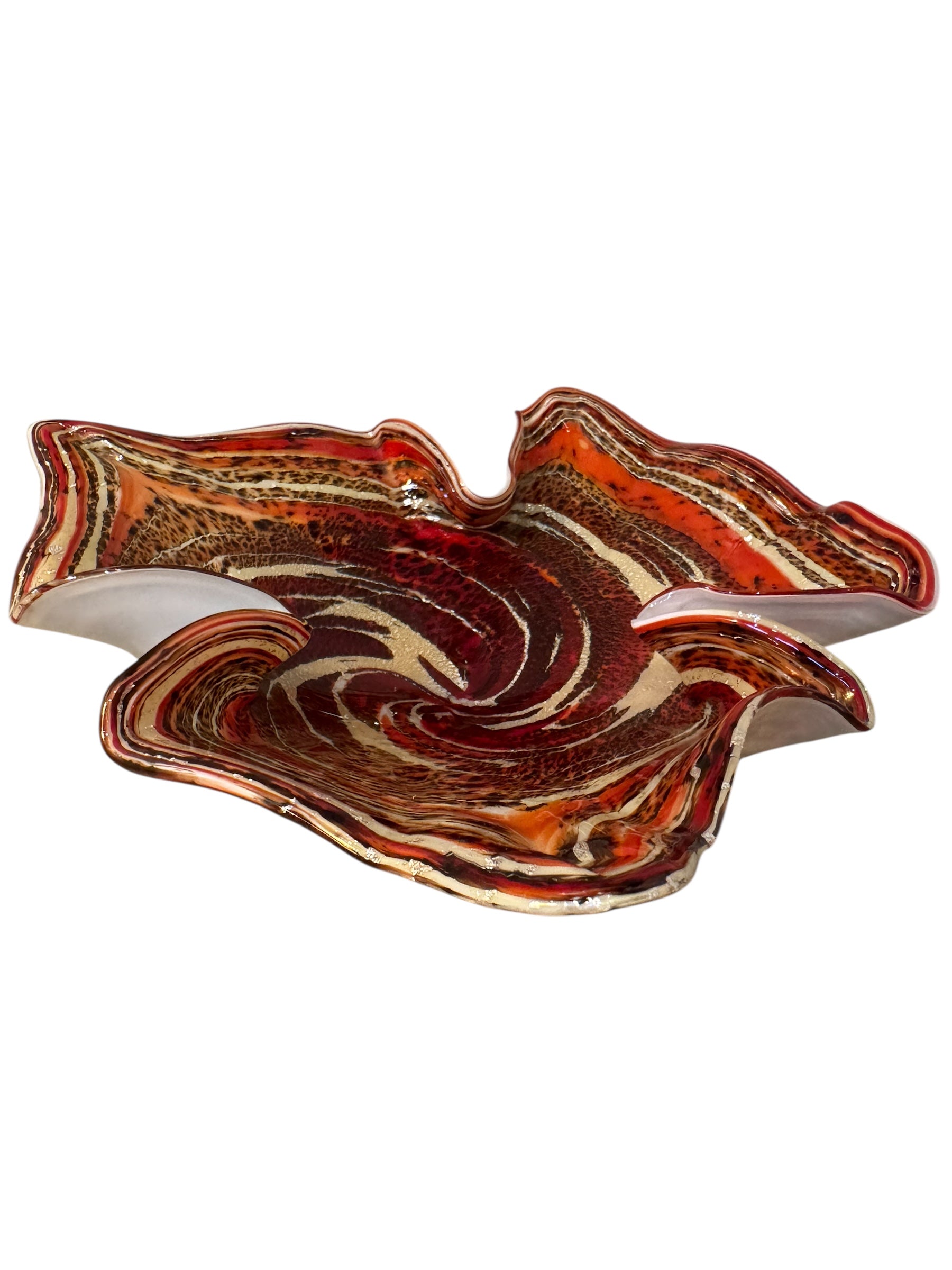 A Murano art glass bowl with a freeform shape, featuring layered swirls of brown, orange, and cream, accented with gold flecks. The bowl has a translucent white base.