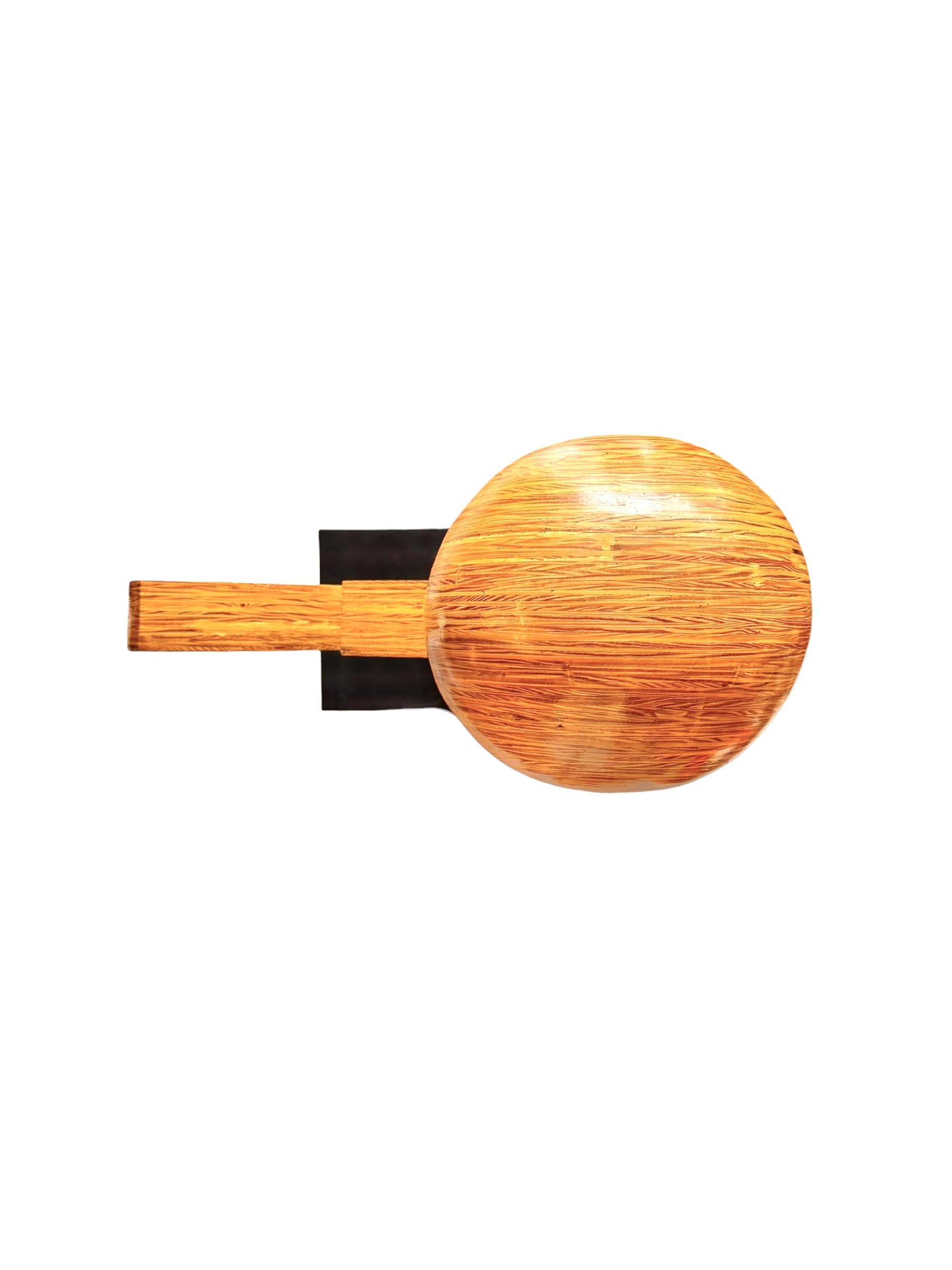 A wooden sculpture featuring a dark square base, a vertical trunk that branches into two angled supports, and a turned wooden sphere resting on the higher support.