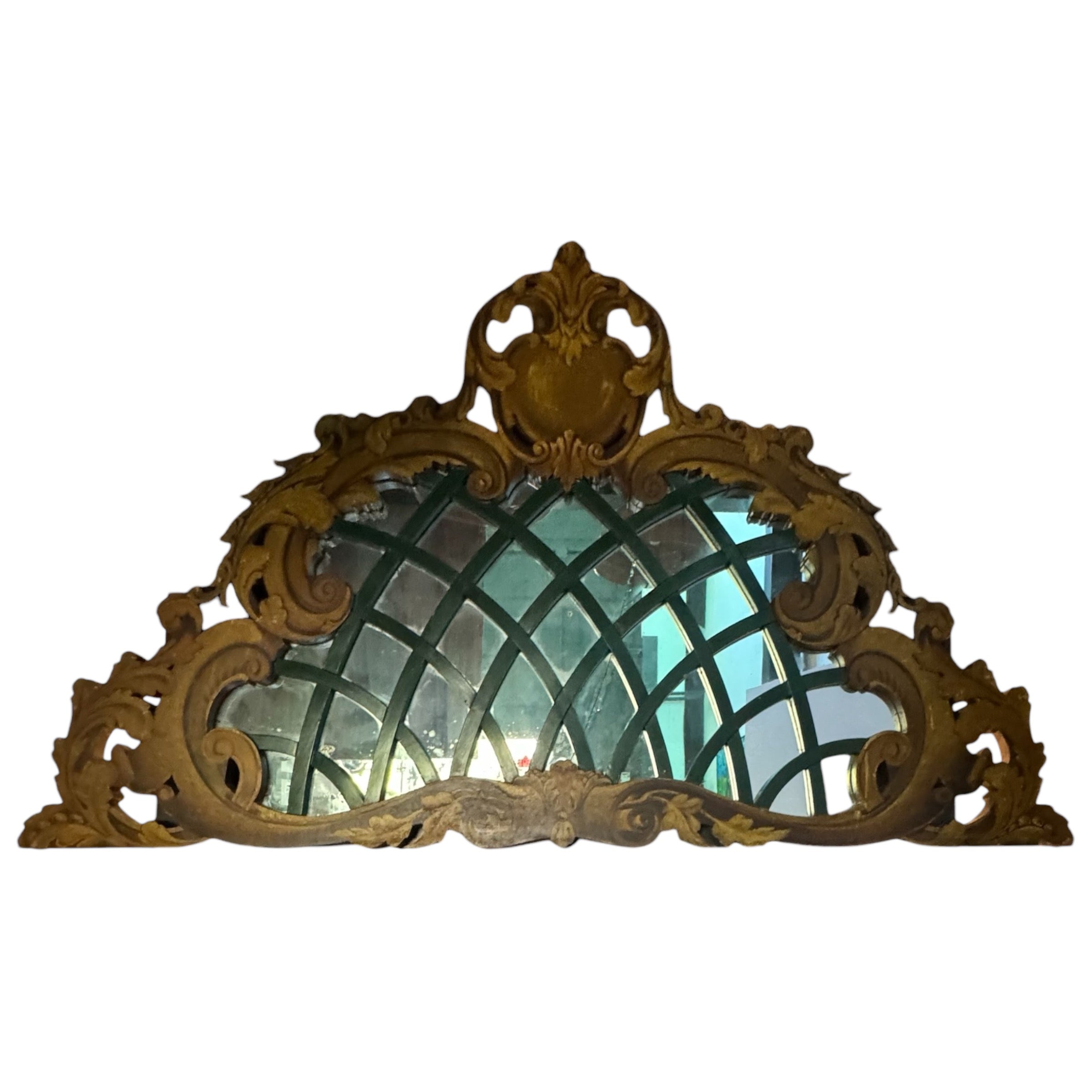 French trompe-l’œil Rococo overmantel mirror featuring ornate gilded frame and intricate carved details. Elegant antique design in excellent condition.