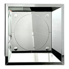 A vintage style geometric square mirror with a silver frame and reflective surface, showing signs of wear.