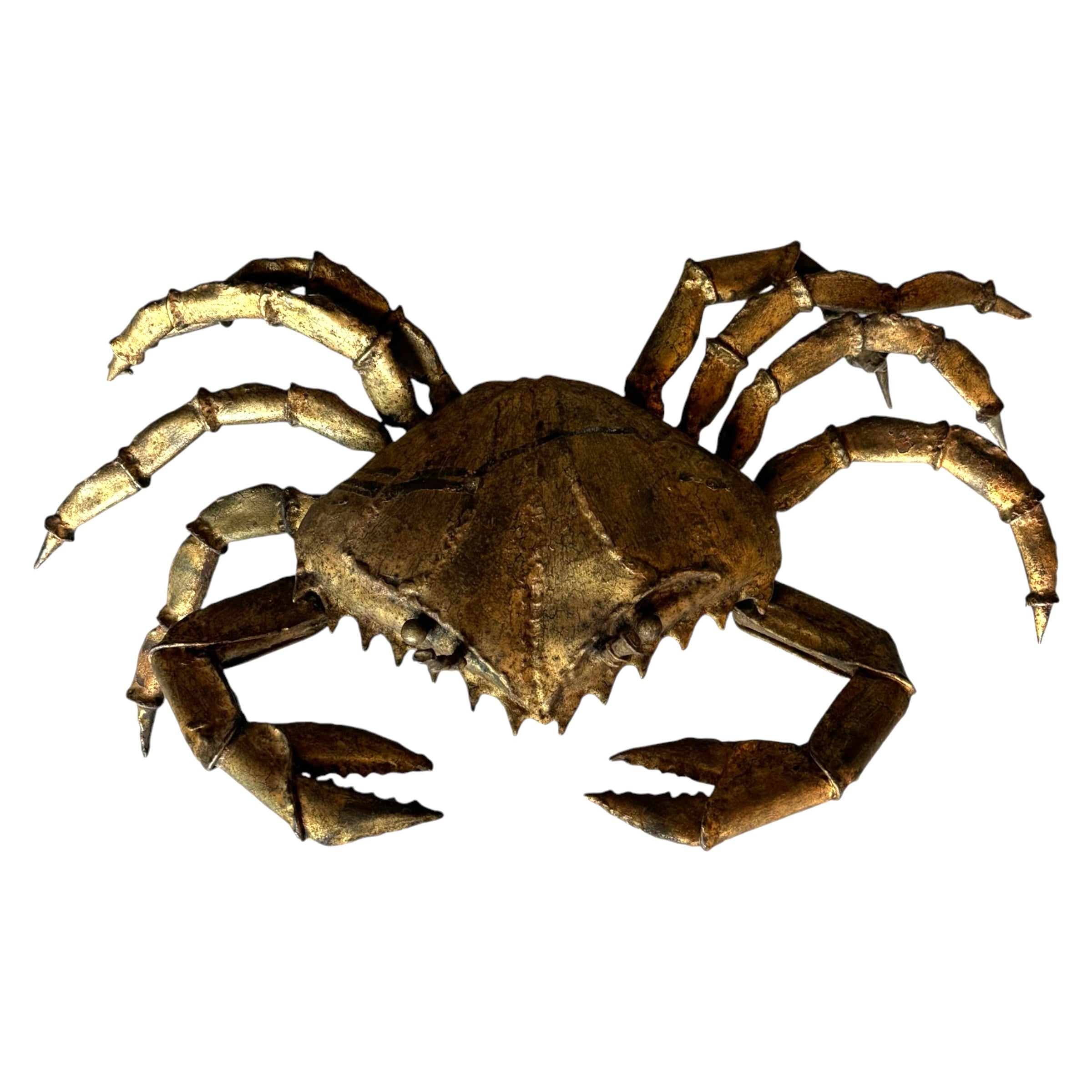 A gilt-metal crab sculpture with a mottled surface, crafted from steel, with realistic detailing of the crab's form.