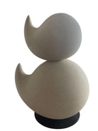 "Renzo Buttazzo's 'Lovers,' a sculpture made from Pietra Leccese featuring two stacked, rounded forms with subtle projections, on a black base."
"Modern sculpture of two smooth, light-colored forms stacked on top of each other, with a small horn-like protrusion on each."