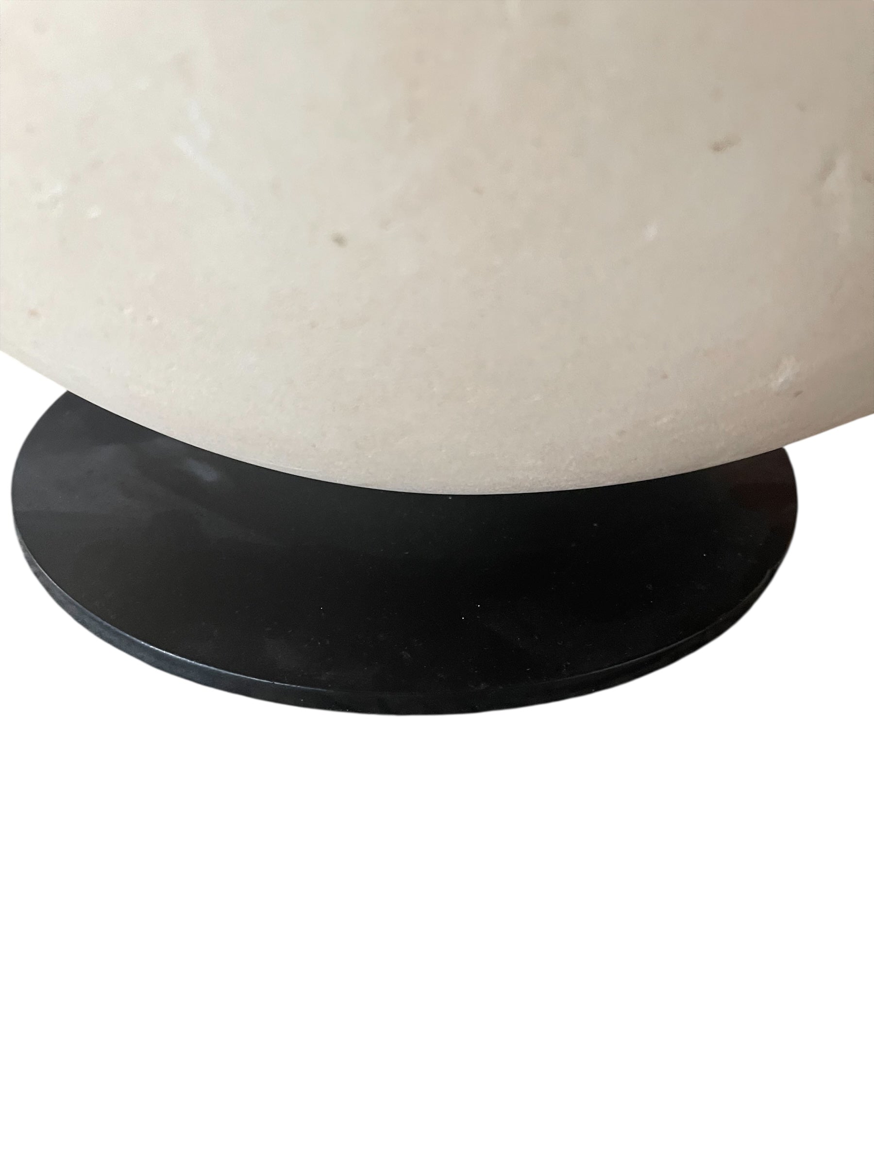 "Renzo Buttazzo's 'Lovers,' a sculpture made from Pietra Leccese featuring two stacked, rounded forms with subtle projections, on a black base."
"Modern sculpture of two smooth, light-colored forms stacked on top of each other, with a small horn-like protrusion on each."