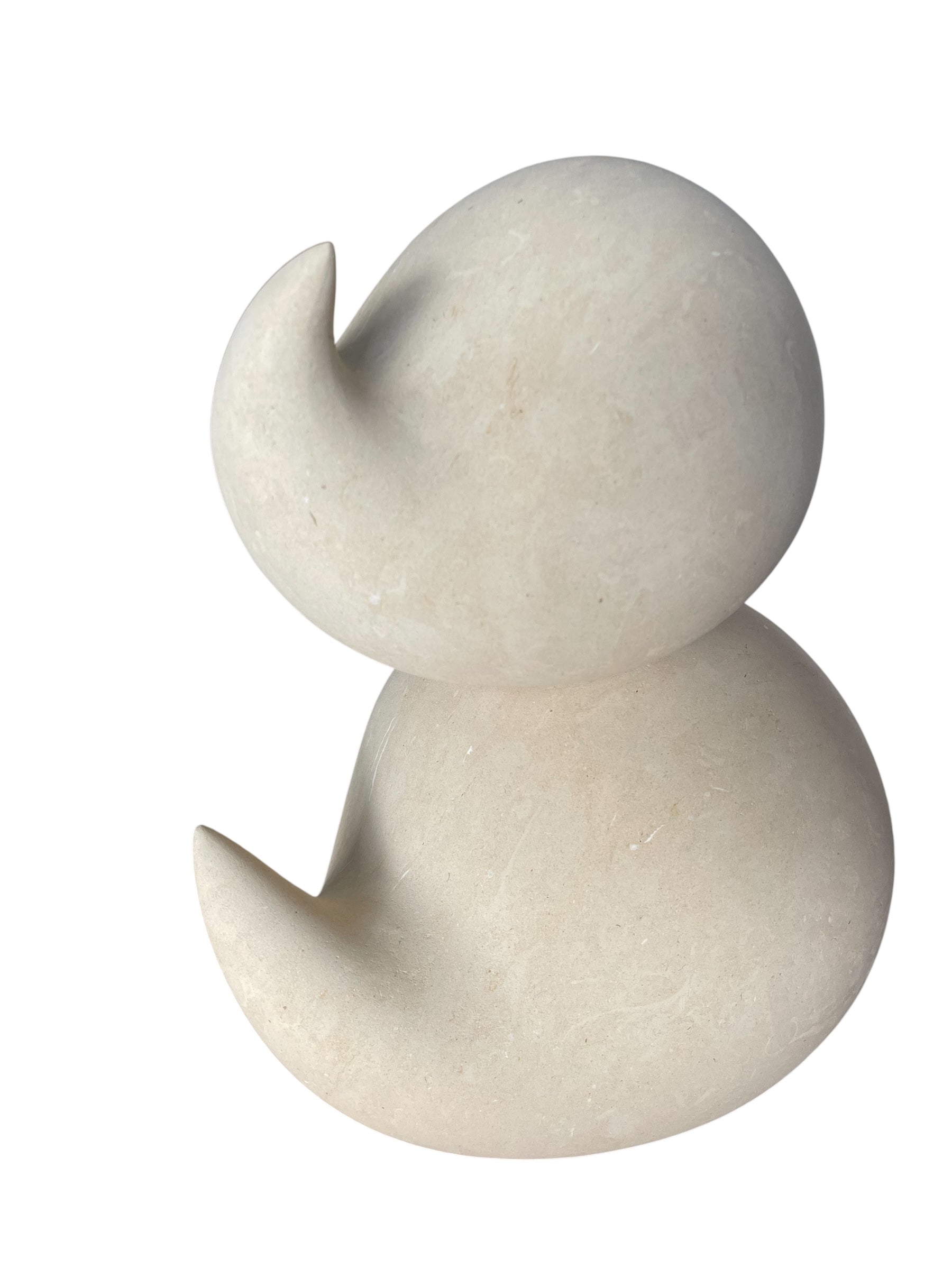 "Renzo Buttazzo's 'Lovers,' a sculpture made from Pietra Leccese featuring two stacked, rounded forms with subtle projections, on a black base."
"Modern sculpture of two smooth, light-colored forms stacked on top of each other, with a small horn-like protrusion on each."