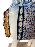 Ceramic horse by Domenico Pinto, featuring a white glazed body, geometric quilting on the saddle, gold accents, and 24Kt gold detailing. The horse stands on four legs and is placed on a white base.