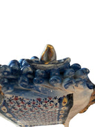 Ceramic horse by Domenico Pinto, featuring a white glazed body, geometric quilting on the saddle, gold accents, and 24Kt gold detailing. The horse stands on four legs and is placed on a white base.