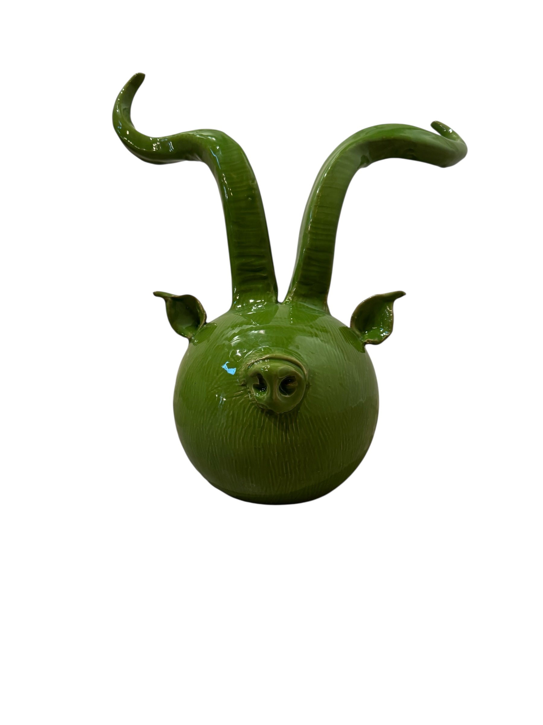 Glossy green ceramic pig sculpture with exaggerated, upward-curving horns and a snout. From Italy. Enza Fasano. Ceramic.
Il_Suino_Cornuto_by_Enza_Fasano_Ceramiche