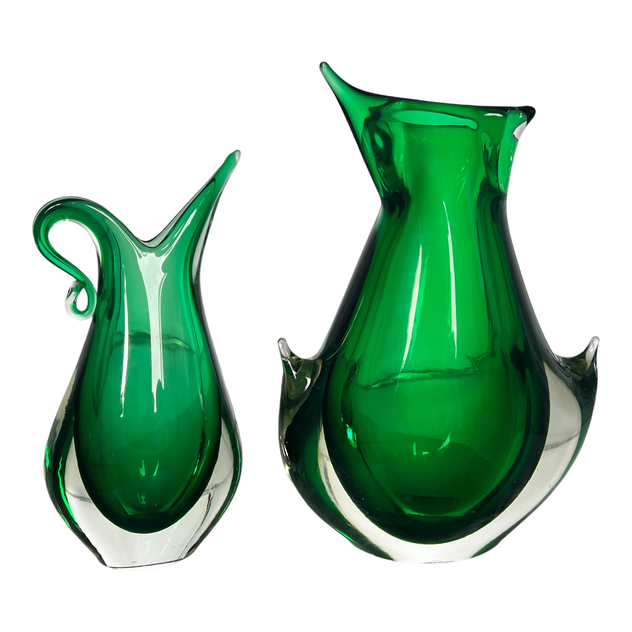 A pair of emerald green Murano glass vases with a distinctive shape, crafted by Flavio Poli for Seguso.