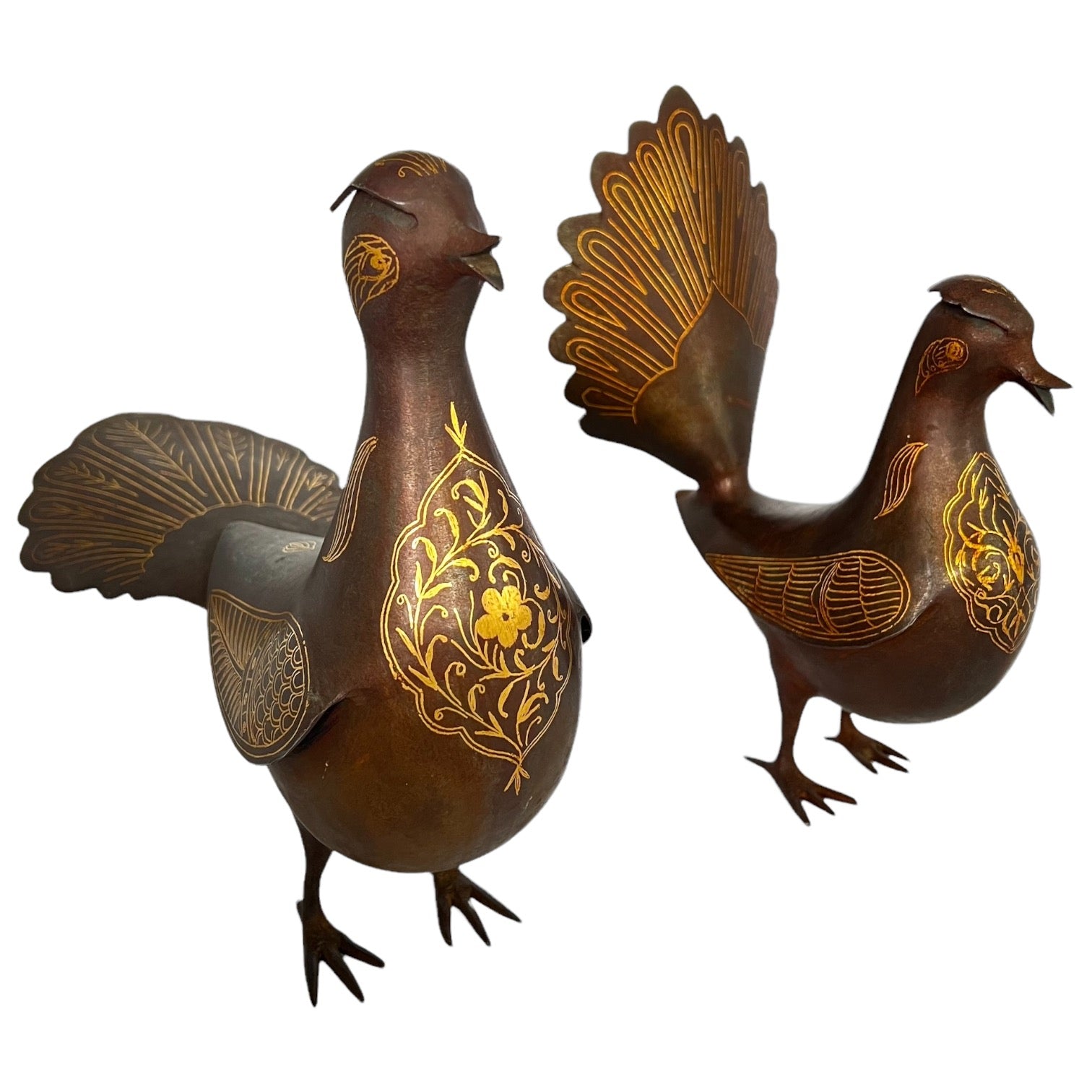 Two metallic, antique,  Persian damascene birds with gold patterns, one larger and one smaller.