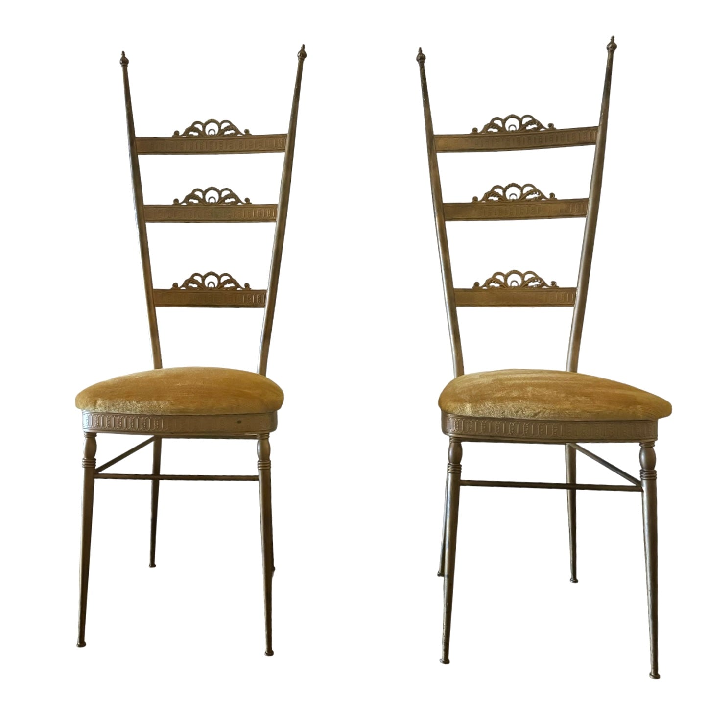 A pair of Italian brass mid-century ladder back Chiavari chairs with original velvet upholstery in a golden yellow hue.
Pair of Italian Brass Mid Century Ladder Back Chiavari chairs