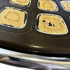 Vintage
UK
tortoise
tea table
Table
Side table
Occasional table
mandala
Entry table
Coffee table
Chrome
1970s
leather-like tortoise shell design
mandala design
geometric
geometric design
patterned table top
groovy
chrome table
chrome table austin