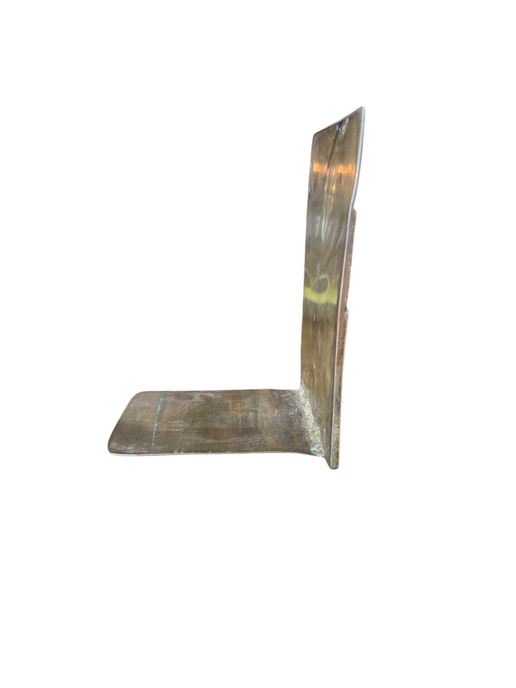 Close-up of two David Marshall Brutalist bookends. The bookends feature contrasting silver and bronze metal panels, separated by raised textured bronze seams. The bookends have a rough, geometric design.