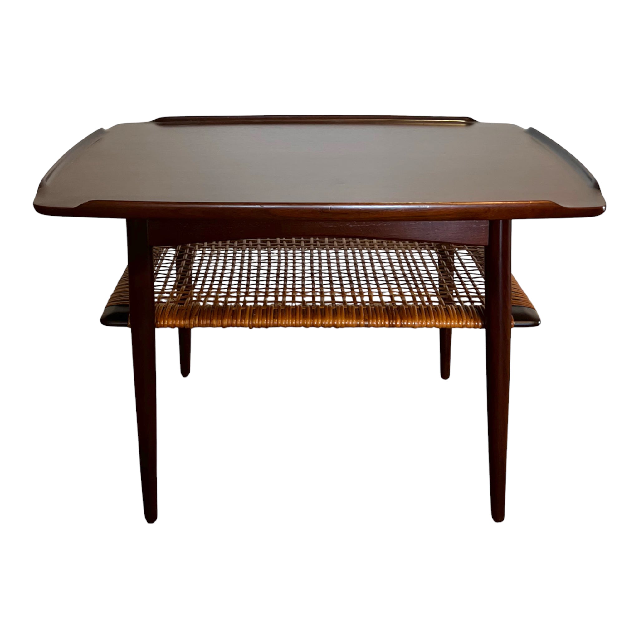 A rectangular walnut occasional table by Poul Jensen with a woven cane lower shelf, Danish Mid-Century Modern style.