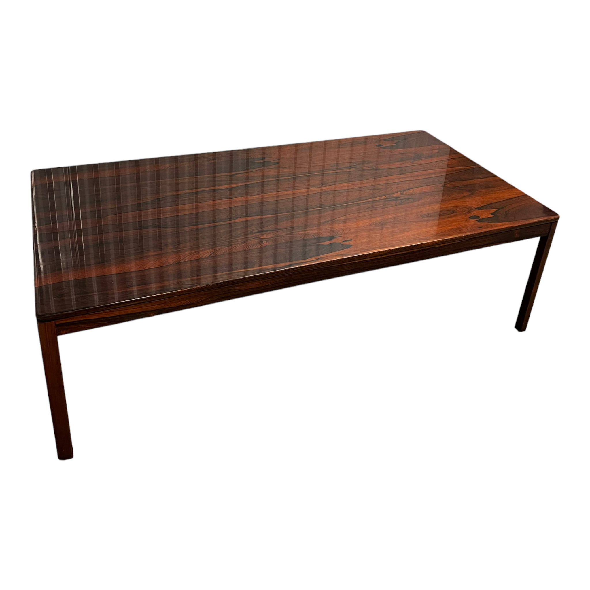 Mid-Century rosewood coffee or center table by Brode Blindheim for Sykkylven, Norway. Minimalist design with straight legs, clean lines, and striking wood grain. Manufacturer’s mark present. Substantial size, excellent vintage condition with minor wear.