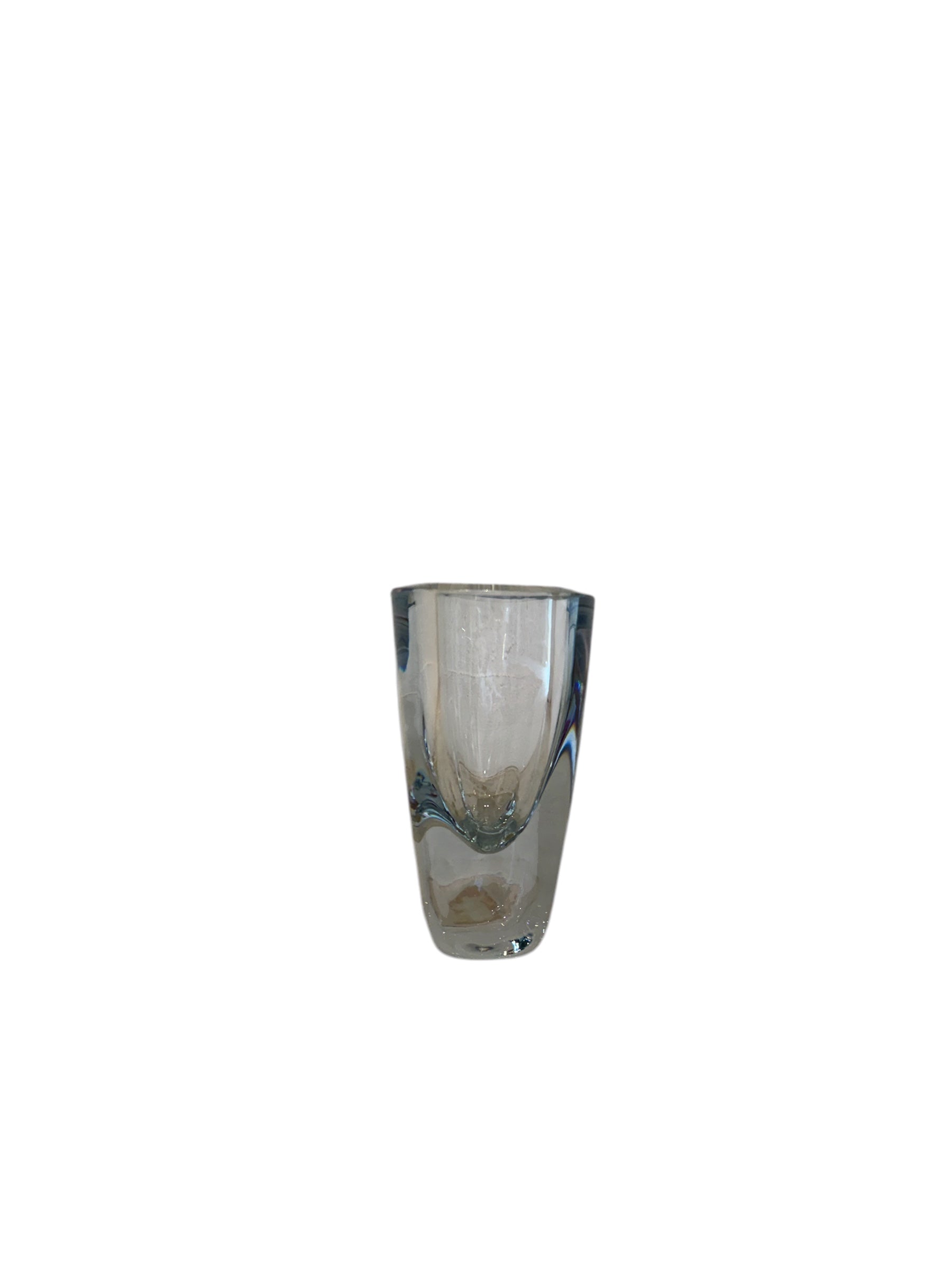 A vintage Strömbergshyttan crystal vase with a clear body and a fluid curve interior, standing on a flat surface.