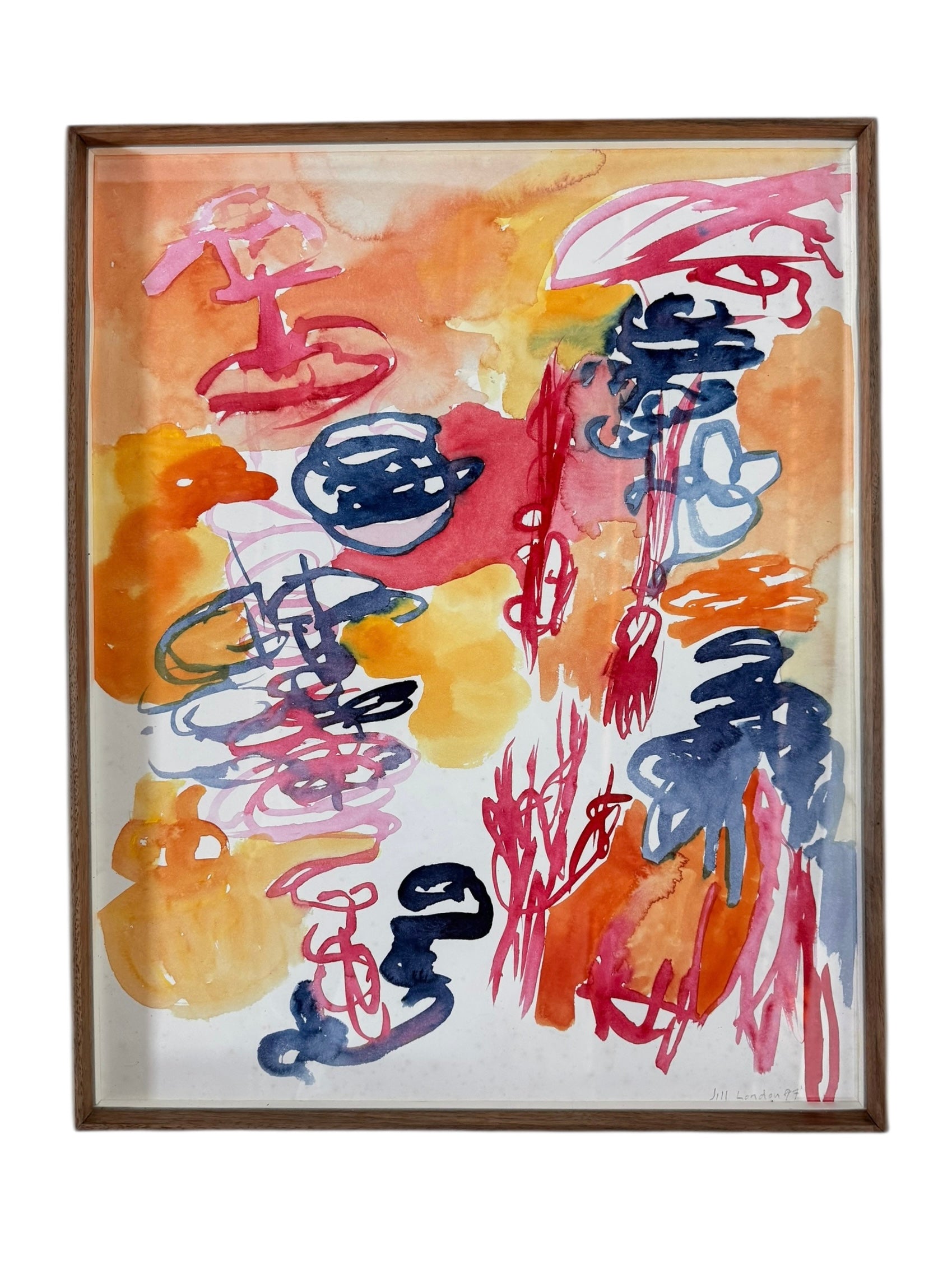 A vertical watercolor painting on paper, framed in a simple dark wood frame. The piece consists of a lively arrangement of gestural, loopy shapes and washes in a warm palette of apricot, magenta, and deep navy blue. The shapes are layered and translucent, with some areas featuring saturated "blooms" of color and others showing thin, wiry line work. The artist's signature and the year '97 are visible in the bottom right corner.