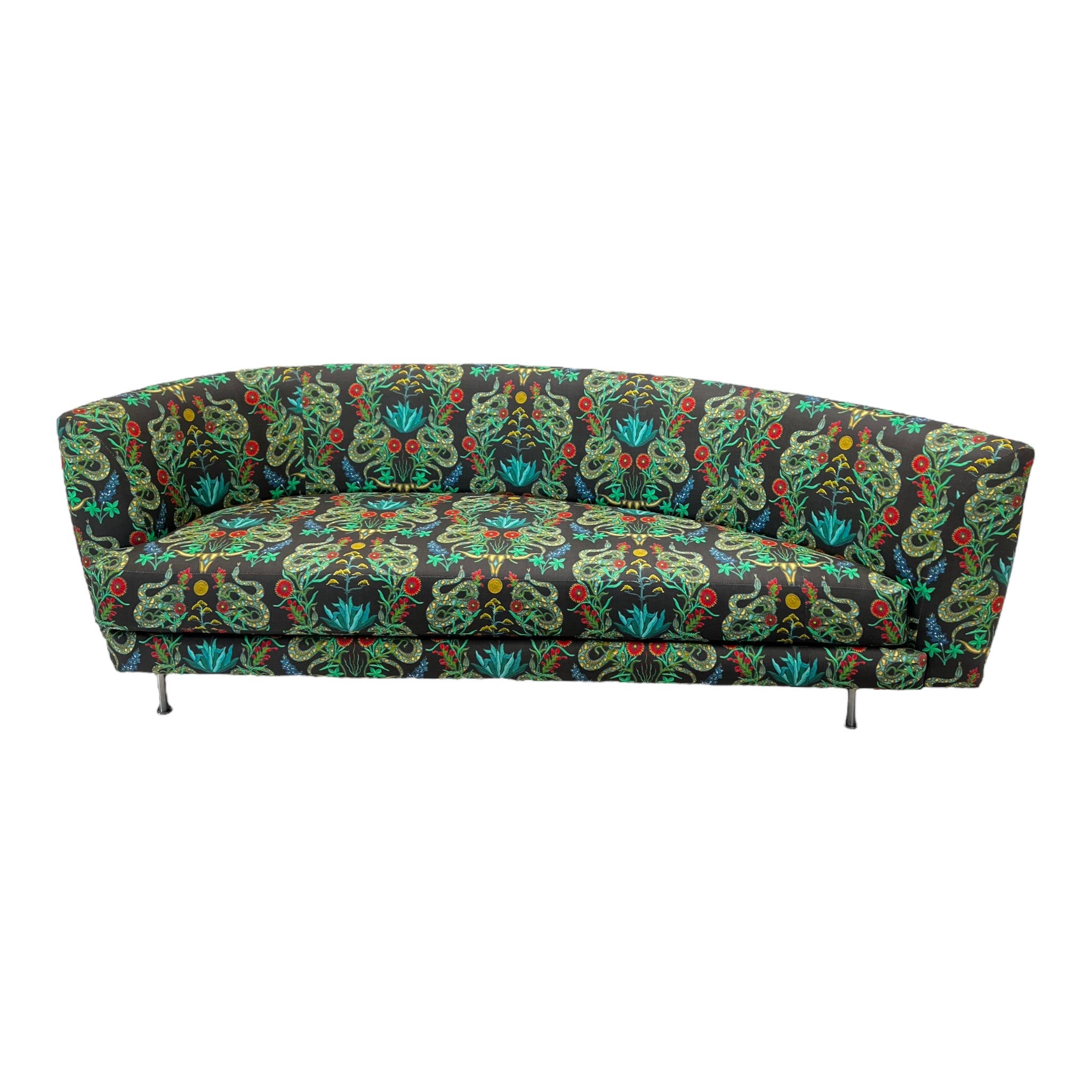 A Thayer Coggin rounded sofa with a Counterpart Studios multicolored floral pattern on the upholstery, featuring a vintage frame and metal legs.