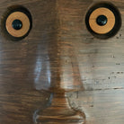 Artisan wood wall sculpture with human face