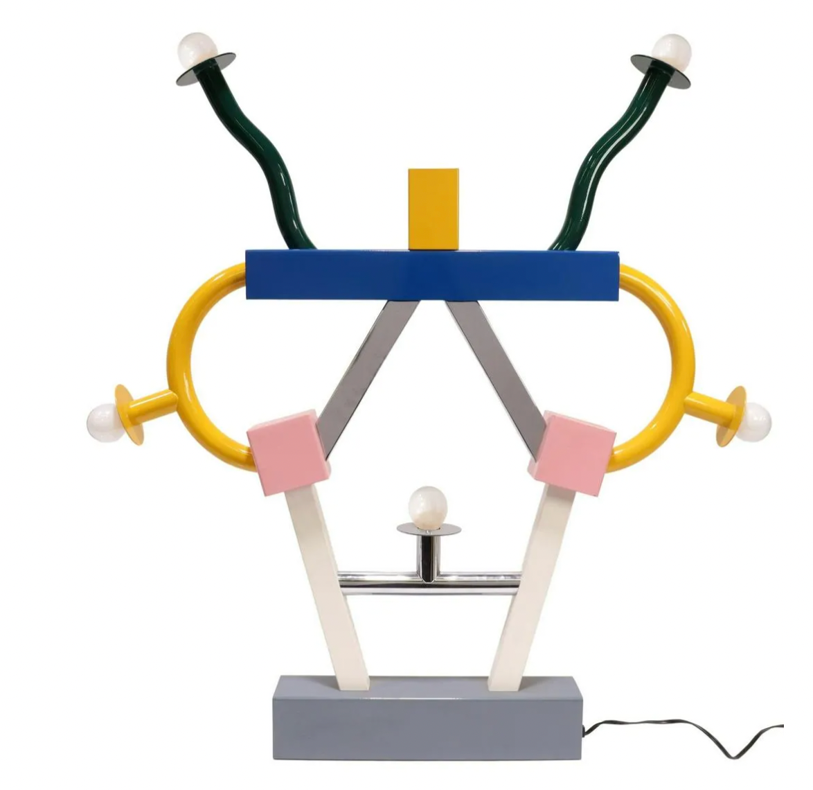 A colorful Ettore Sottsass 'Ashoka' table lamp with a geometric design, featuring semicircular elements and a base, primarily in blue, yellow, and gray tones. 1981 Ashoka Lamp by Ettore Sottsass