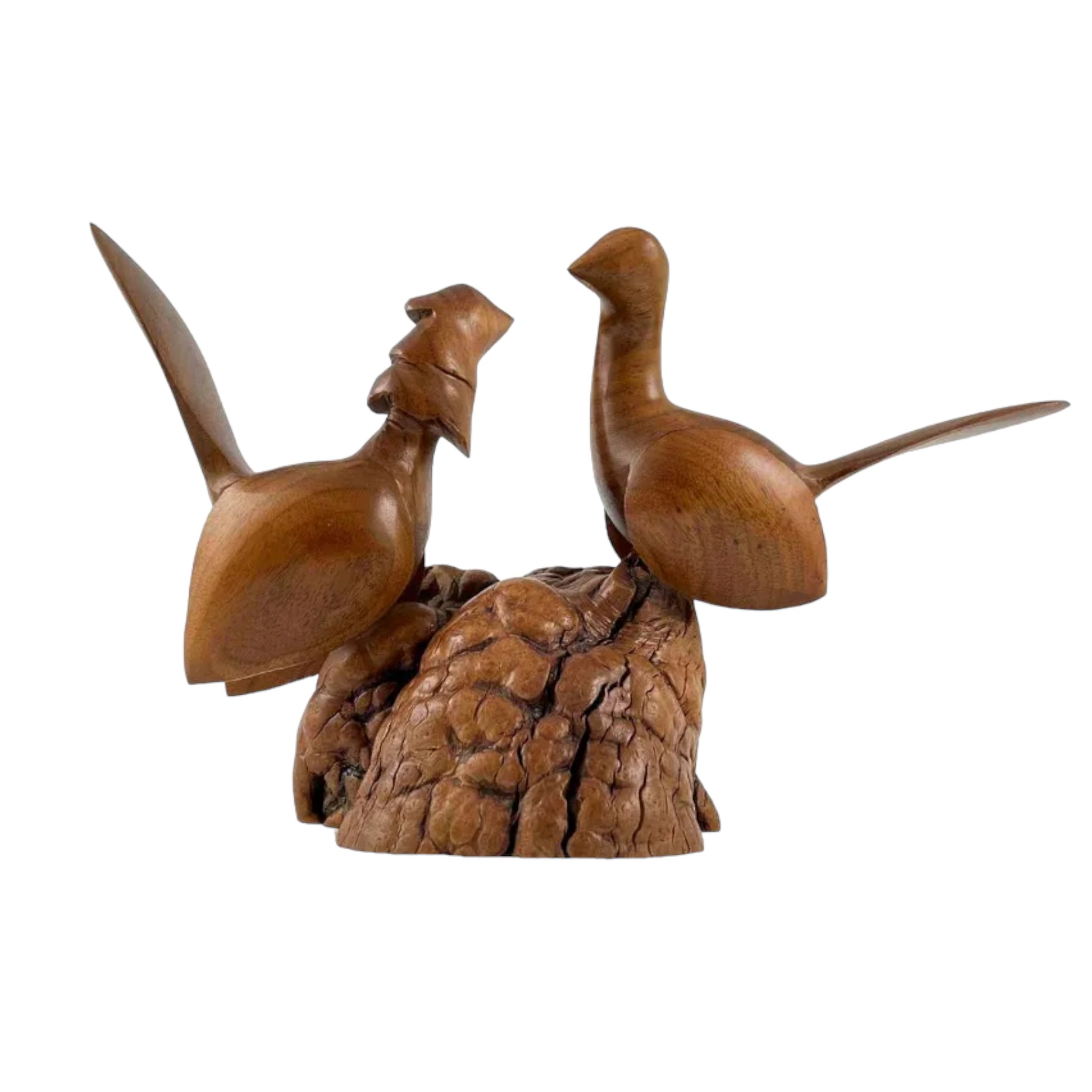 A sculpture of a pair of birds perched on a rock, made of burl wood with a smooth finish.