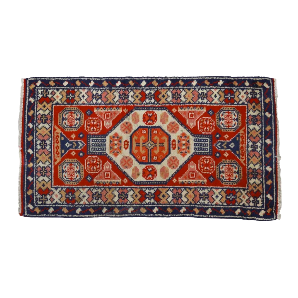 Handwoven Erivan rug with vibrant red, blue, and gold field. Central ivory octagonal medallion surrounded by stylized floral motifs, enclosed within a continuous linked flower head border. Rectilinear flora and fauna designs characteristic of the Mountainous Caucasus region of Armenia and Azerbaijan. Professionally cleaned, excellent condition.
Hand tied Erivan Rug