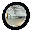 Round postmodern mirror with minimalist design, sleek frame, and contemporary style. Excellent vintage condition.
