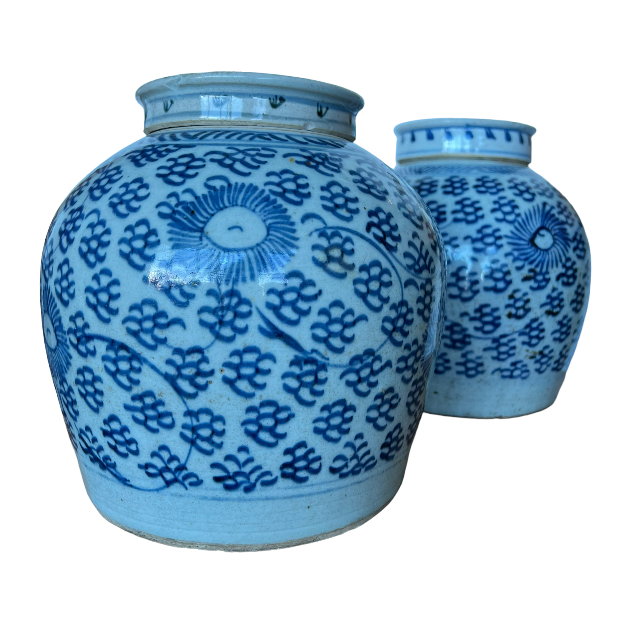 A pair of blue and white porcelain jars with floral patterns, including chrysanthemums, from the 19th century.