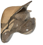 A ceramic sculpture of a bulldog's head by Enza Fasano. The piece features a glossy, glazed finish with a sophisticated color palette of muted greys, creams, and earthy brown tones arranged in bold, abstract striped patterns across the face and ears. The bulldog has characteristic folded ears, a prominent snout, and a soulful, slightly downturned expression. The sculpture is set against a clean, white background, highlighting its smooth texture and reflective surface.