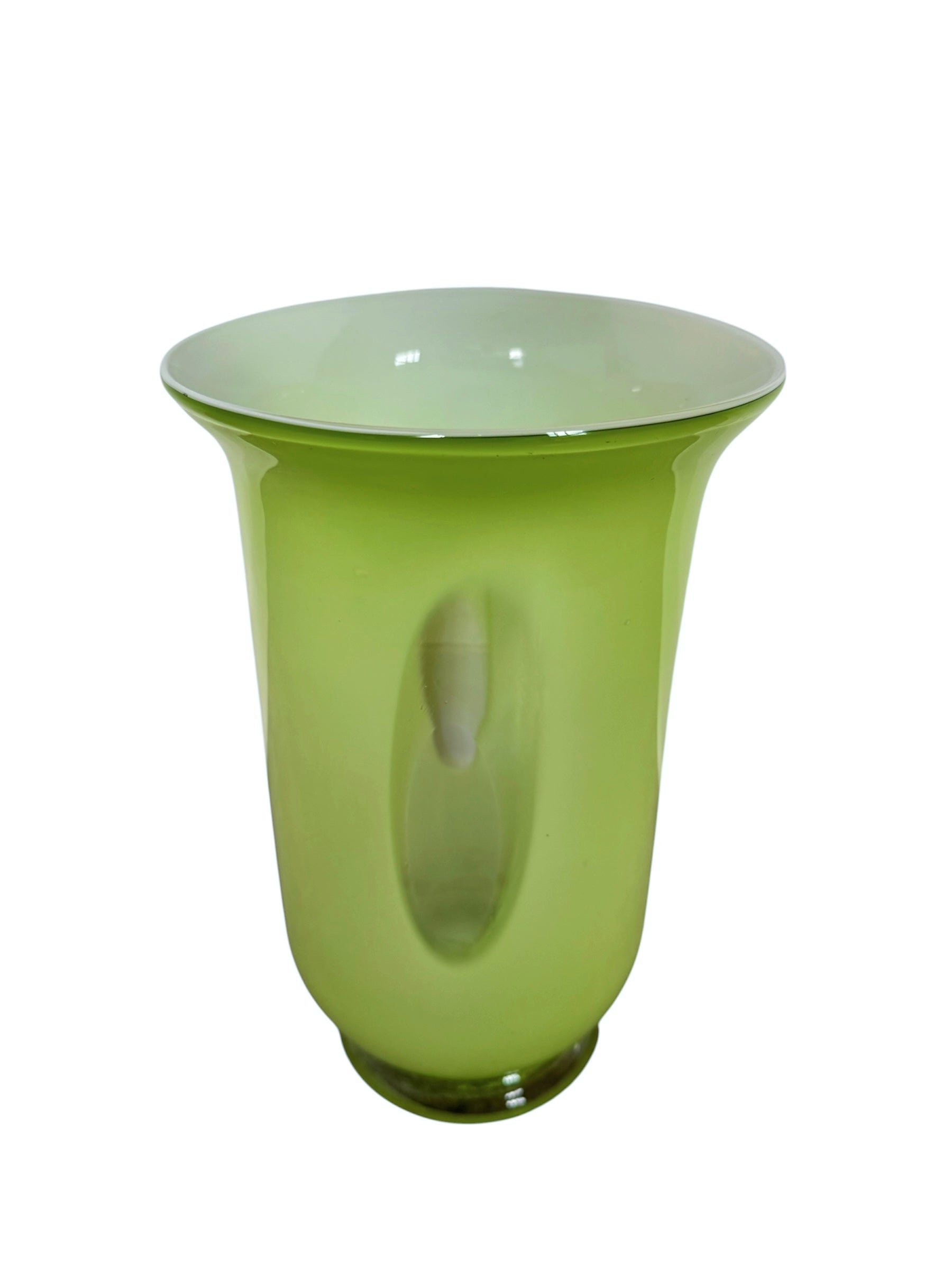 A mid-century modern, lime green cased-glass vase with a wide, flared rim and a thick, clear glass base. The exterior is a glossy chartreuse green, while the interior is lined with solid milk-white glass. The defining feature is a large, vertical oval cutout window that pierces directly through the center of the vase's body, creating an open-air negative space.