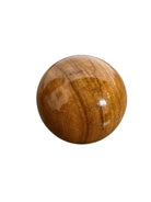 An elegant, hand-carved decorative vase made of polished Pakistani brown onyx. The vase features a classic, rounded urn shape with a tiered, flared neck and a solid matching spherical stone stopper resting on top. The stone displays rich, natural horizontal banding and swirling patterns in shades of honey, deep amber, rust-red, and cream. It stands on a small, integrated pedestal base against a clean white background, reflecting a high-gloss, mirror-like finish.