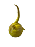 Yellow ceramic sculpture titled 'The Ram Oracle' by Enza Fasano, featuring a round body with intricate, hand-incised patterns and long, stylized ram-like horns