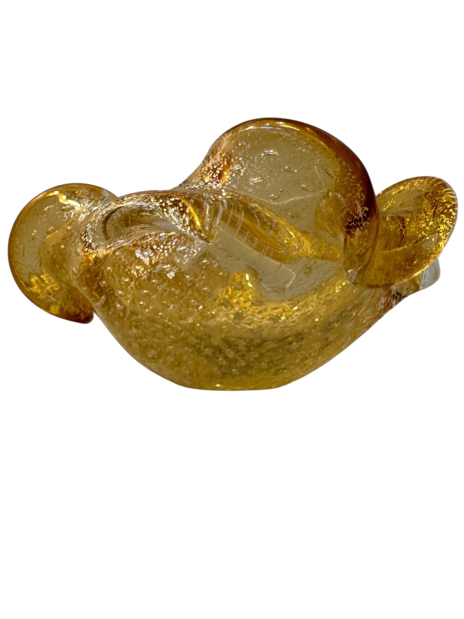 A  vintage Italian Murano glass bowl with a yellow hue, gold Aventurine inclusions, and a bubbly (Bullicante) texture. The bowl is flower-shaped with crimped edge