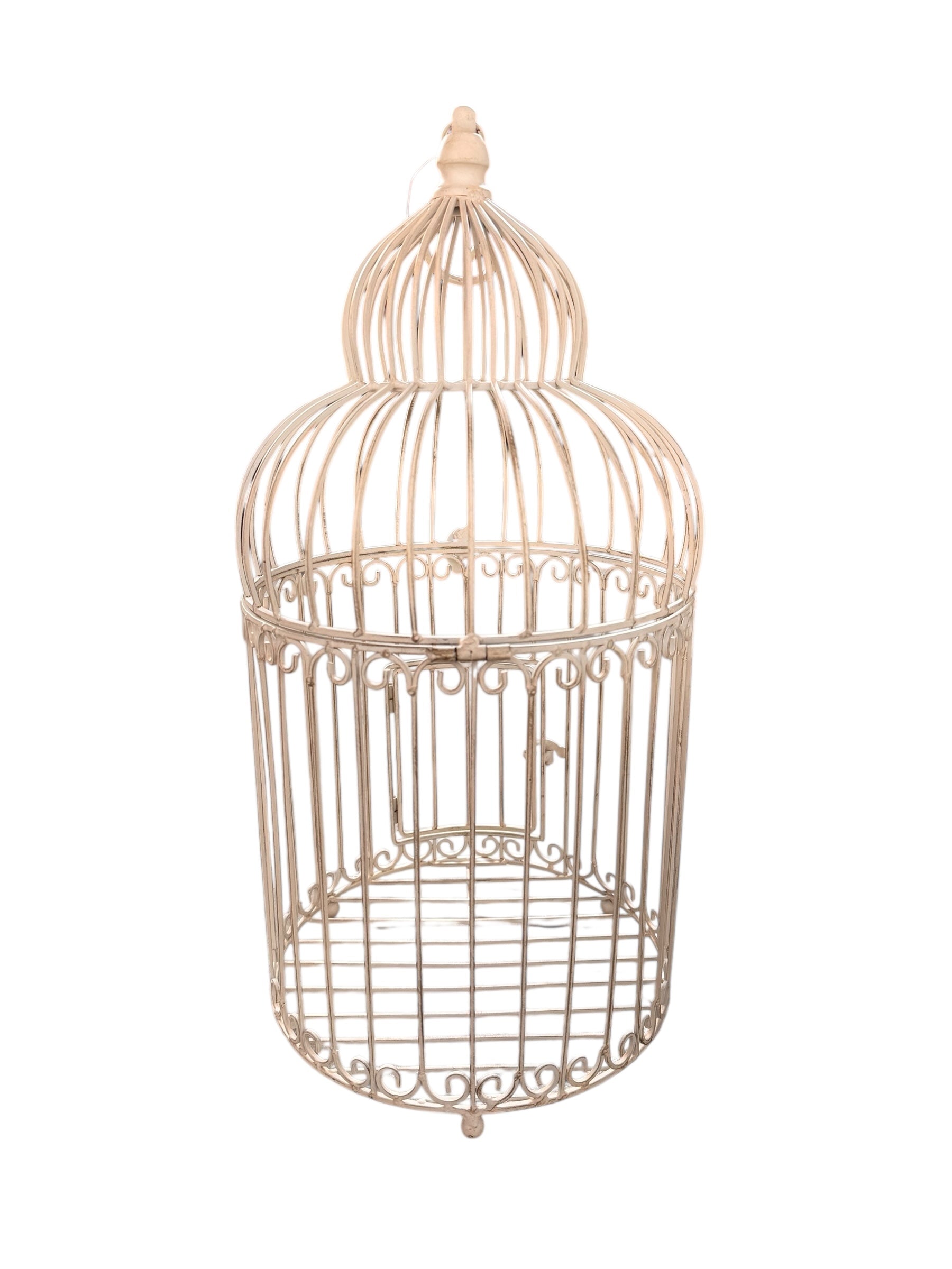 A single, white or cream-colored, decorative wrought iron bird cage with a hinged door and a hanging loop at the top. The cage has a vintage or antique style 