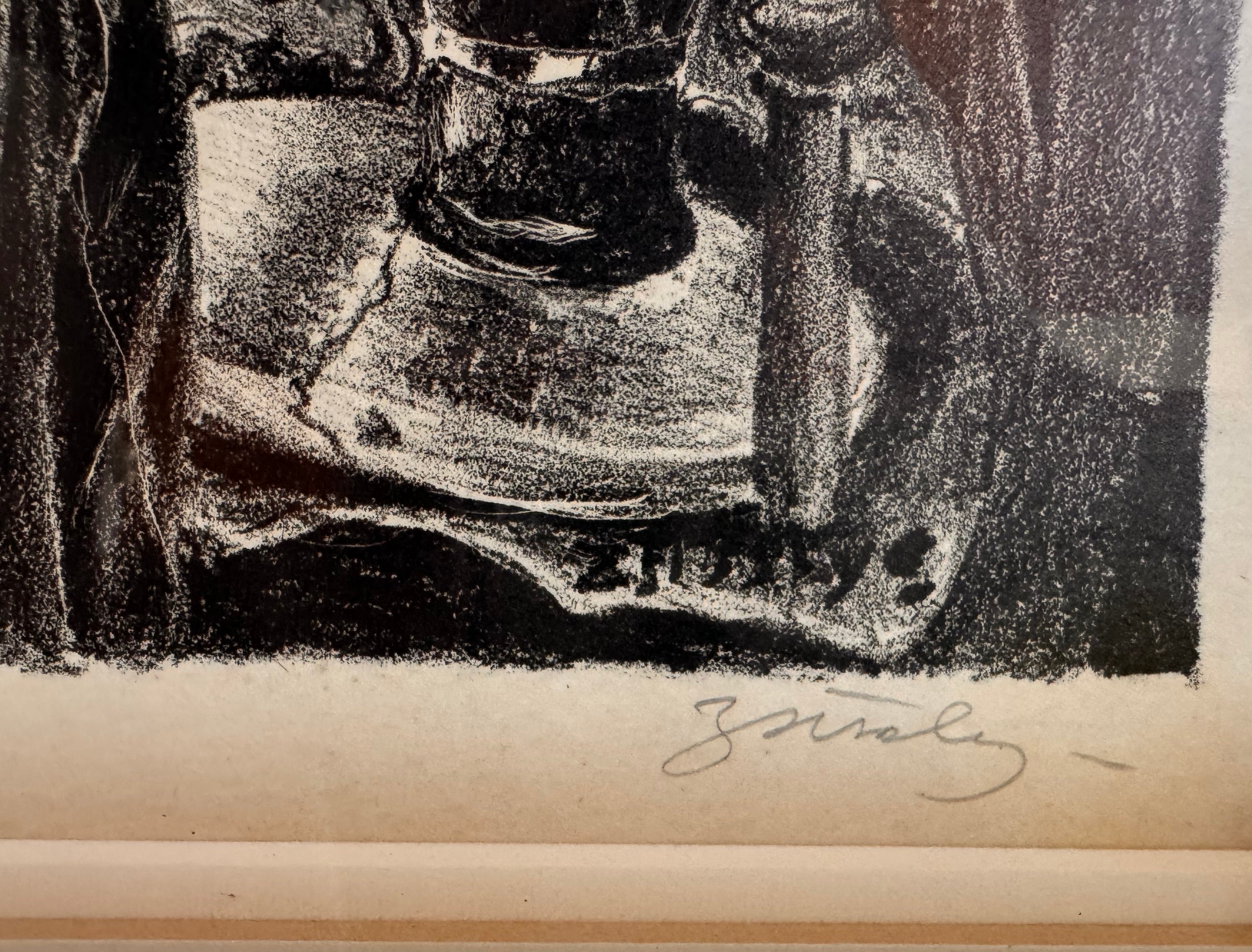 A black-and-white lithograph titled Victoria by the artist Zsissly. A woman with a veil over her dark hair sits directly facing the viewer behind a highly detailed, round dining table crowded with objects. Every inch of the scene is densely textured, depicting a bowl of bananas and grapes, an ice bucket with wine bottles, crystal glassware, a decanter, and a patterned lace tablecloth. The background features intricate floral wallpaper, a paneled door, and heavy drapes. The style is eerie and densely shaded 