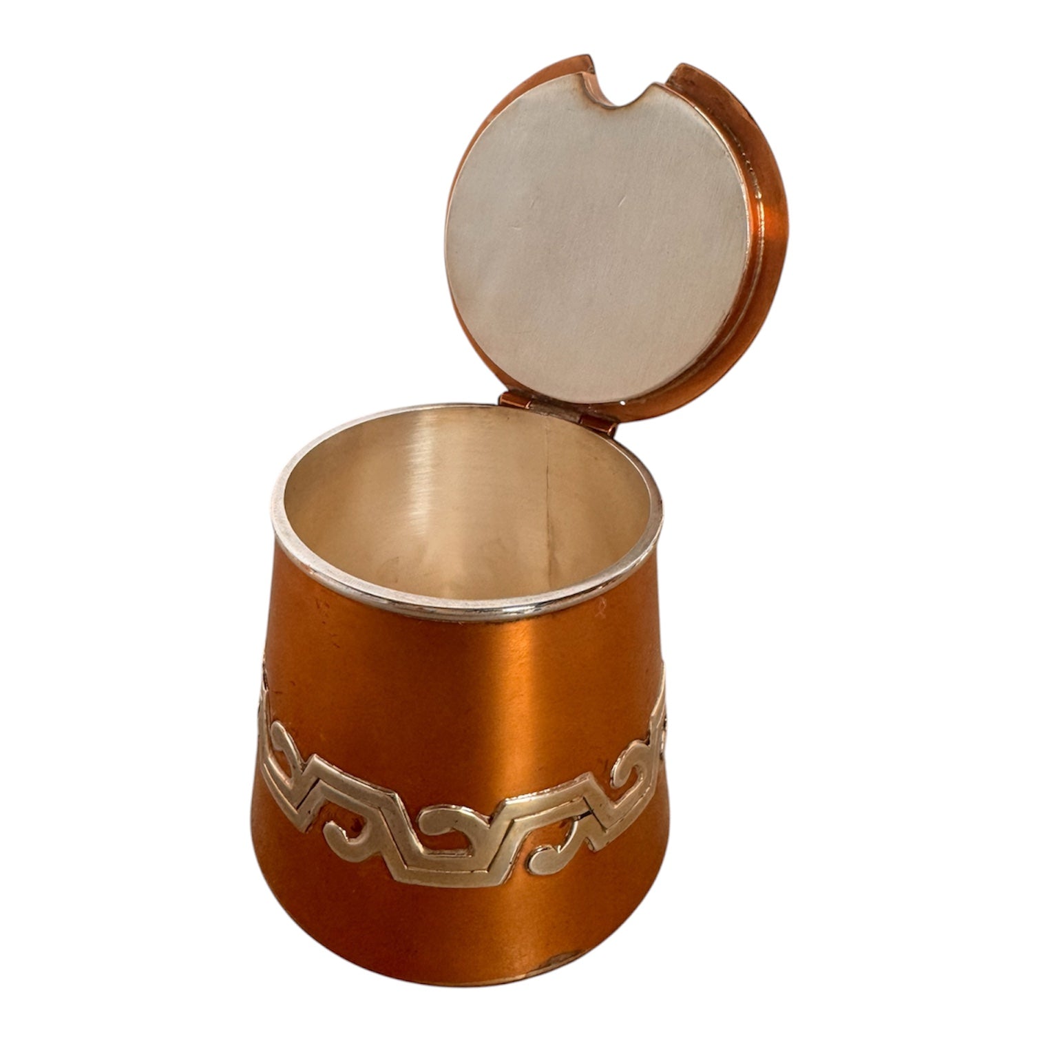 The set includes a large, rectangular, hammered copper tray with geometric openwork handles. Resting on the tray is a tall, slightly tapered copper coffee pot with a wooden handle, a matching smaller creamer pitcher with a similar wooden handle, a lidded sugar bowl, and a tiny matching metal cup or jigger. To the right off the tray sits a large, spherical copper water pitcher or jug with a wide mouth and ice lip.